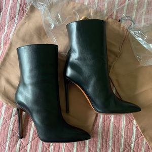 Celebrity favorite designer Madison Alaia black ankle boots